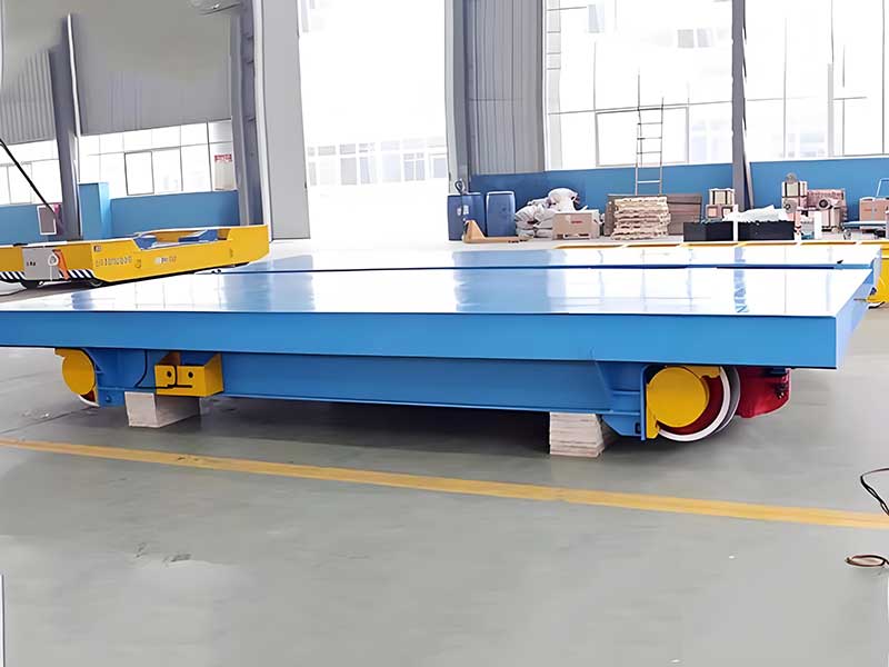 Transfer cart with insulated conductor rail
